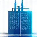 Factory icon with a shield, representing manufacturing operational technology security.